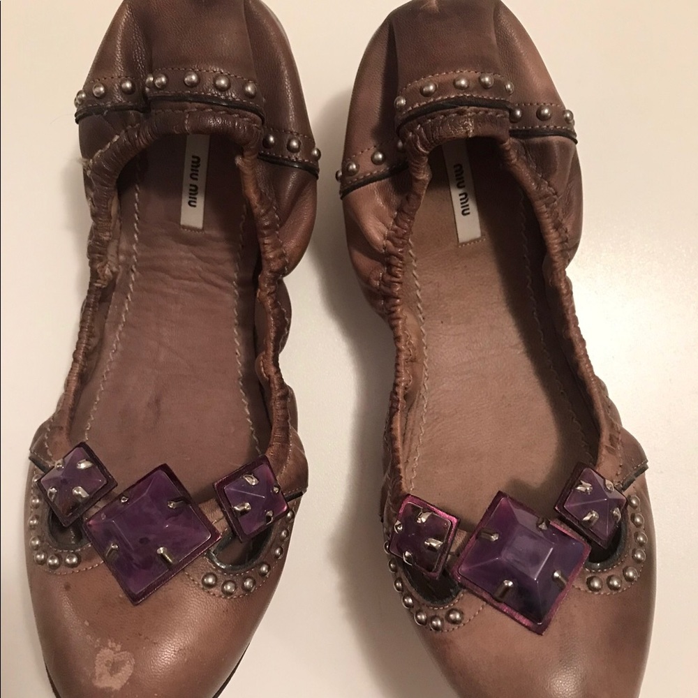 Brown Miu Miu flats.